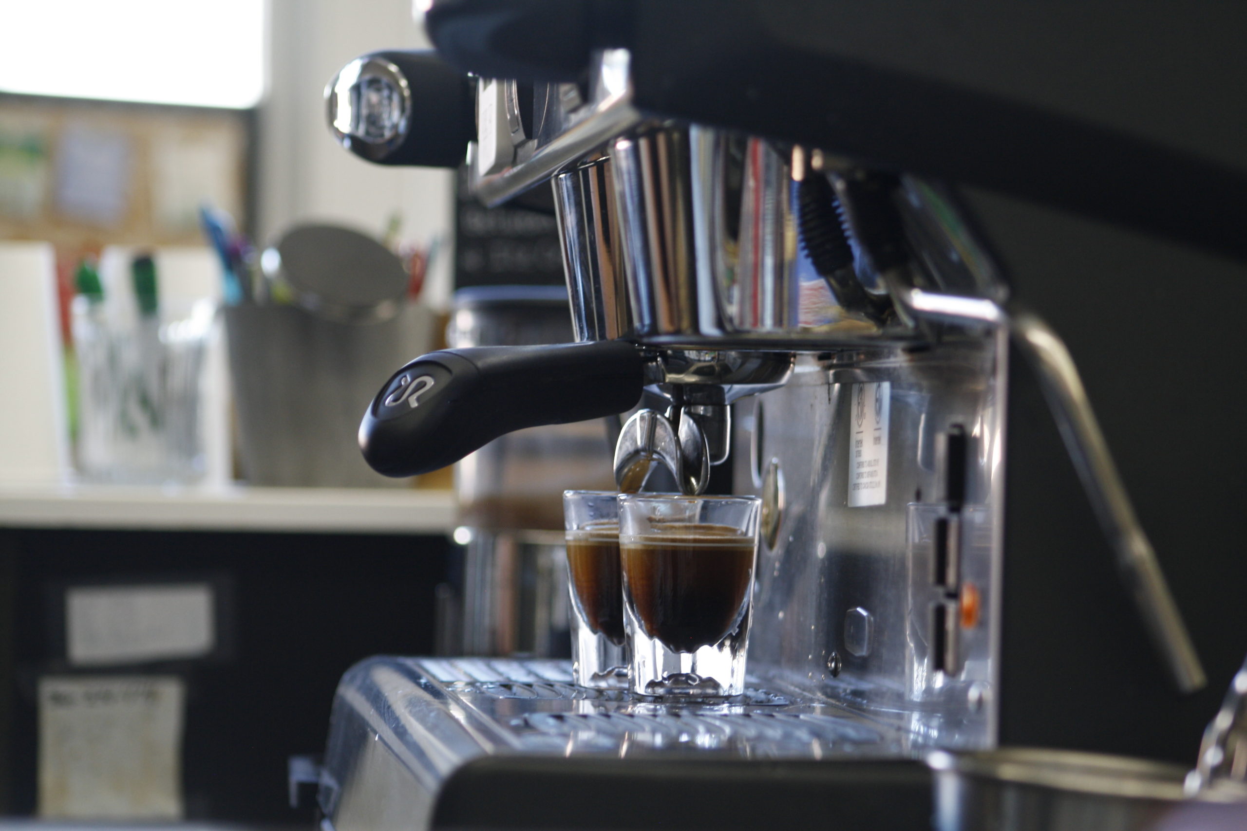 An espresso machine behind the counter at Vault Books and Brew.