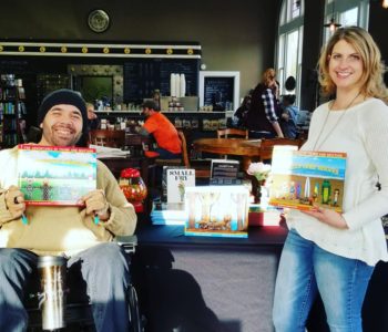 A book signing event at Vault Books and Brew.